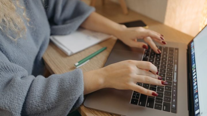 Professional accessing and organising business documents on a computer