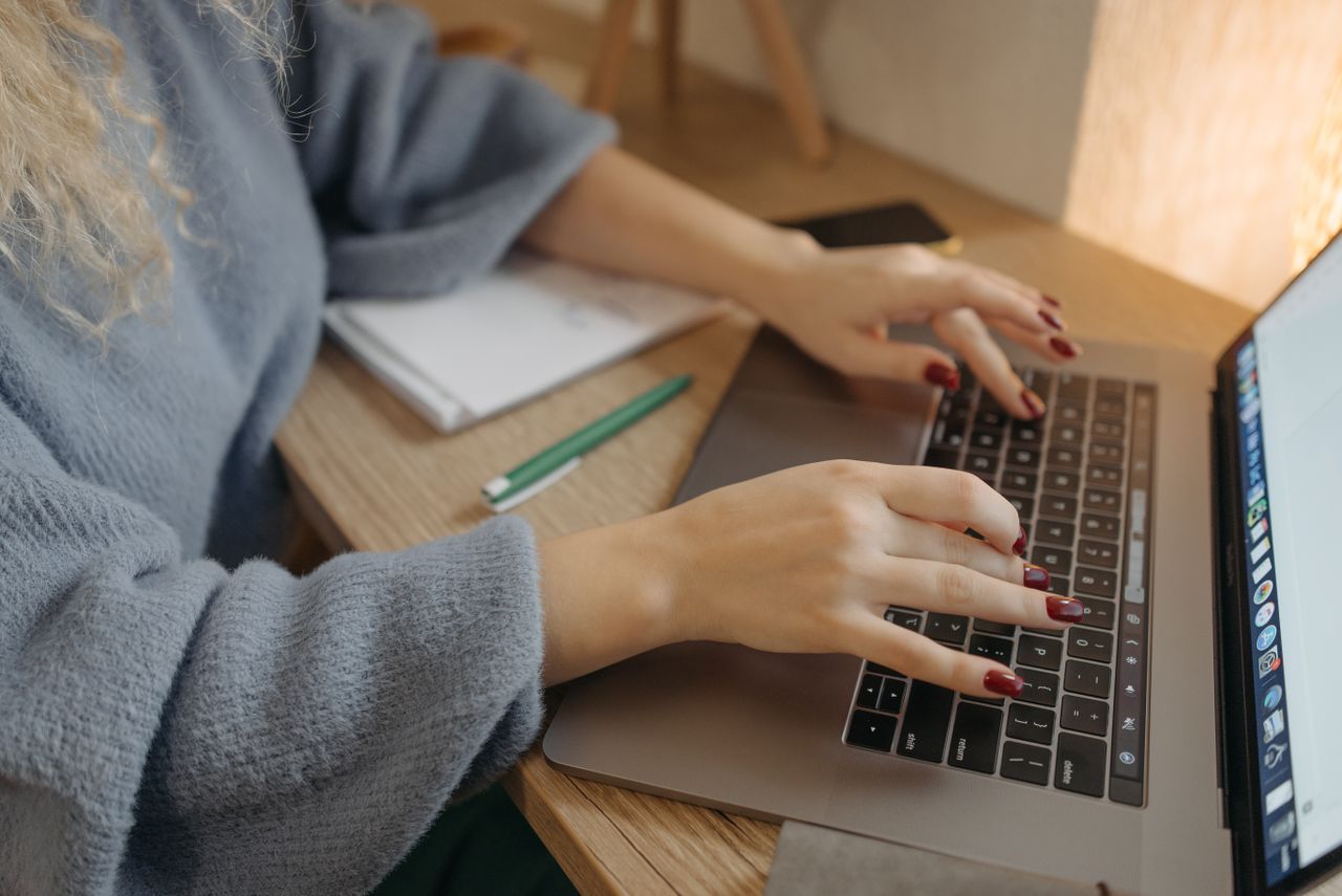 Professional accessing and organising business documents on a computer